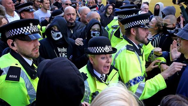 Danielle Brooks (masked) at White Man March Liverpool August 2015