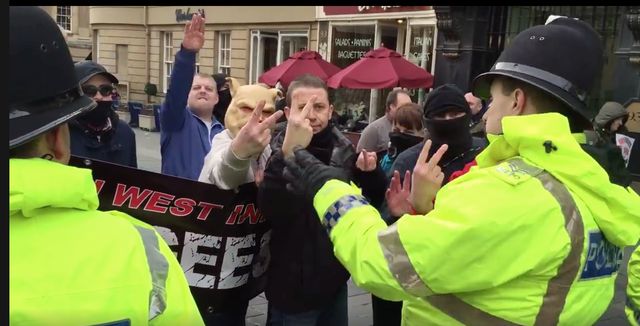 Colon Holmes giving nazi salute